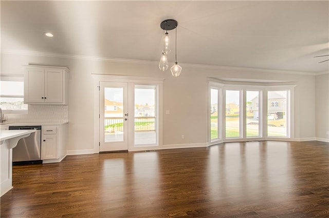9100 NE 98th Ter, Kansas City, MO 64157 - unfurnished living room with dark wood finished floors, french doors, ornamental molding, and recessed lighting