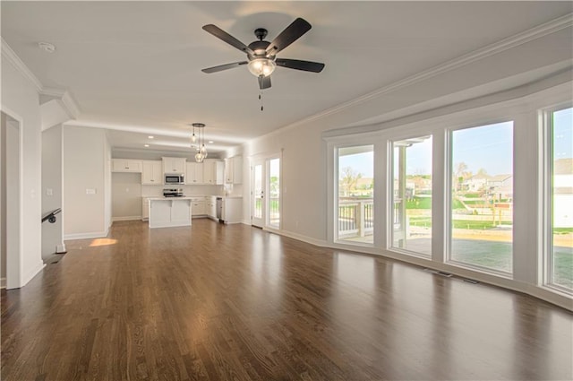 9100 NE 98th Ter, Kansas City, MO 64157 - unfurnished living room with dark wood-type flooring, crown molding, and a ceiling fan