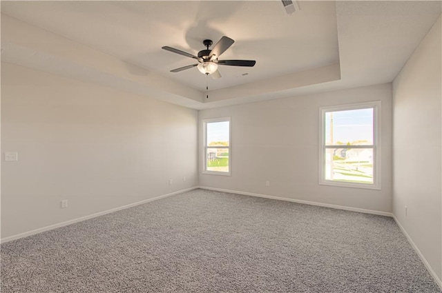 9100 NE 98th Ter, Kansas City, MO 64157 - spare room with carpet, a ceiling fan, and a raised ceiling