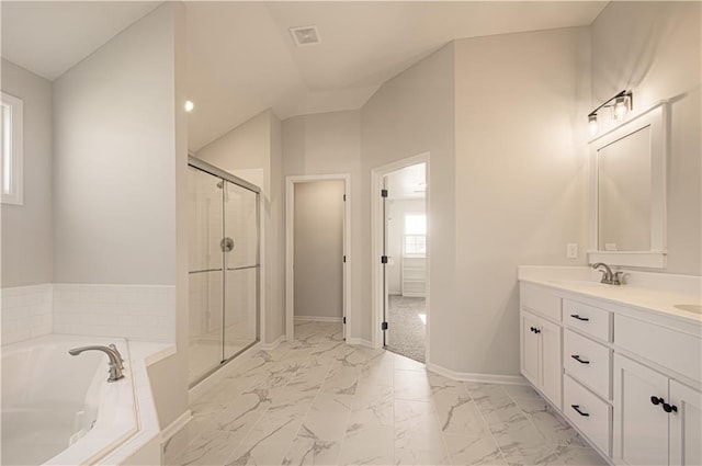 9100 NE 98th Ter, Kansas City, MO 64157 - bathroom featuring marble look tile flooring, double vanity, a garden tub, and a shower stall