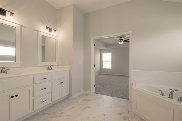 9100 NE 98th Ter, Kansas City, MO 64157 - full bathroom featuring marble look tile flooring, a ceiling fan, double vanity, and a bath