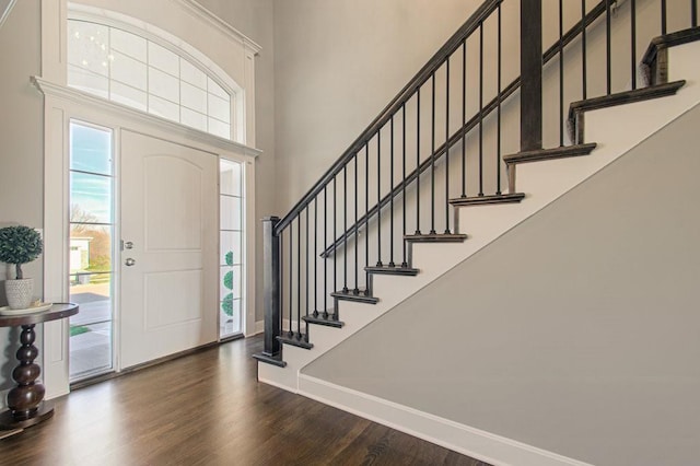 9100 NE 98th Ter, Kansas City, MO 64157 - entryway featuring a high ceiling, dark wood-type flooring, and stairway