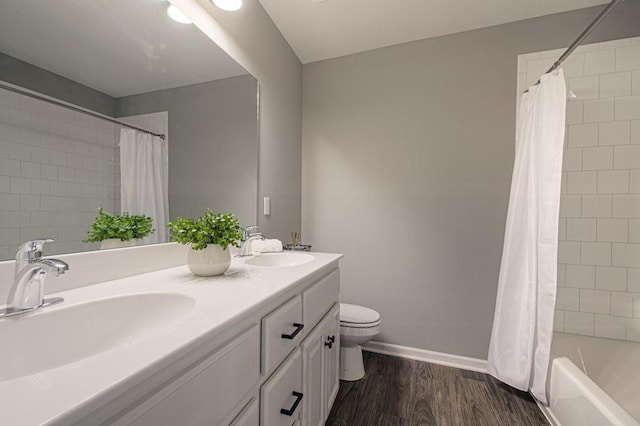 9100 NE 98th Ter, Kansas City, MO 64157 - bathroom featuring double vanity, shower / bath combination with curtain, and wood finished floors