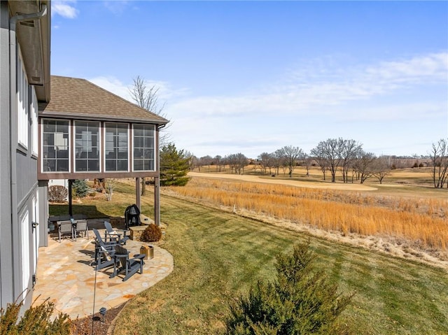 view of yard featuring a patio area and a sunroom