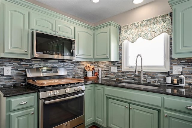 kitchen featuring appliances with stainless steel finishes and green cabinets