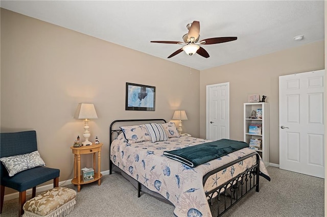 bedroom with carpet floors, baseboards, and a ceiling fan