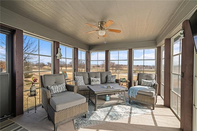 sunroom / solarium featuring wood ceiling and ceiling fan