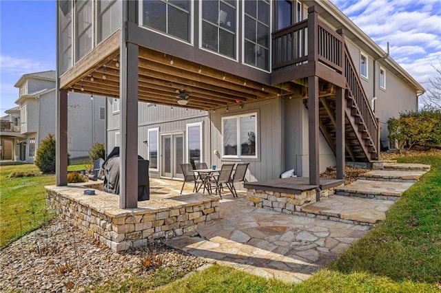 back of house with a patio area, stairs, and a deck