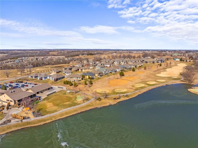 birds eye view of property featuring a water view and a residential view