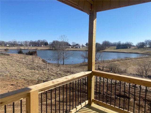 wooden deck with a water view