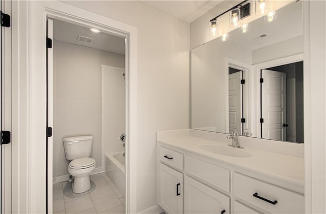 bathroom featuring vanity, baseboards, visible vents, tile patterned flooring, and toilet