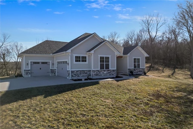 view of front facade featuring stone siding, a front lawn, concrete driveway, and an attached garage