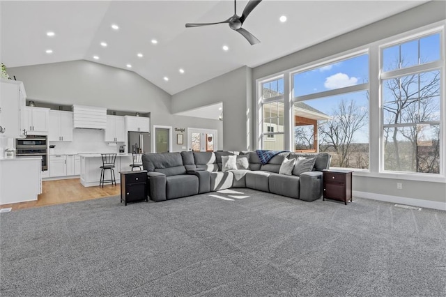 living room featuring baseboards, recessed lighting, high vaulted ceiling, and a ceiling fan