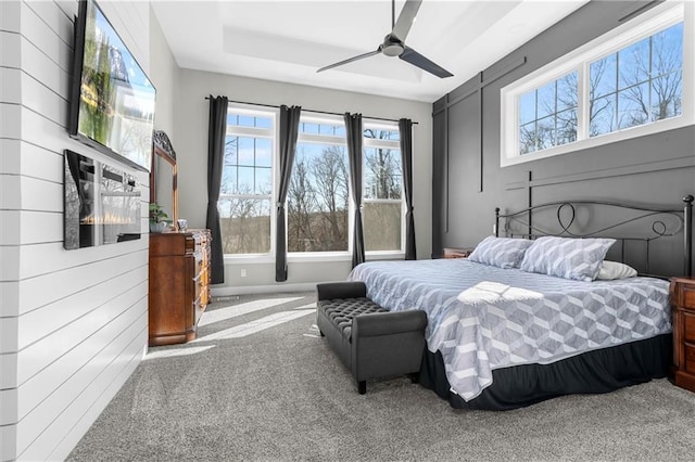 bedroom featuring ceiling fan and carpet