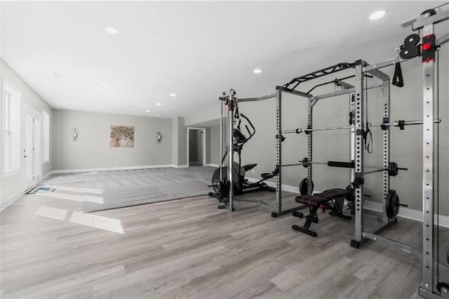 workout area with recessed lighting, wood finished floors, and baseboards