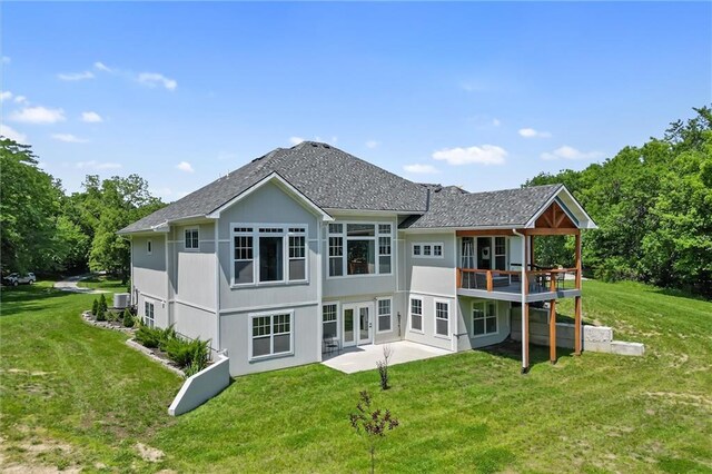13723 Raliegh Ln, Holt, MO 64048 - rear view of house featuring french doors, a yard, a deck, and a patio