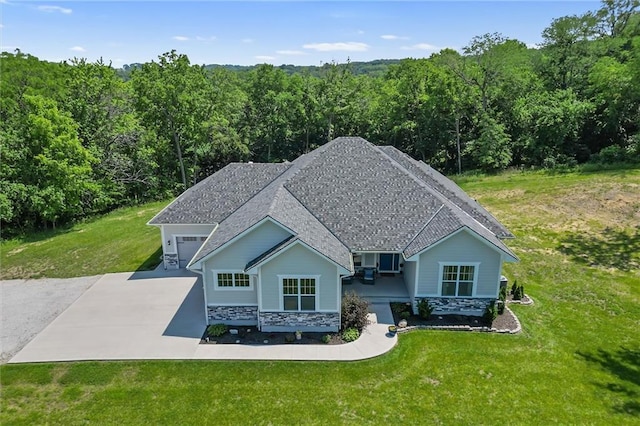 13723 Raliegh Ln, Holt, MO 64048 - view of front of property with a forest view, stone siding, a front yard, and driveway
