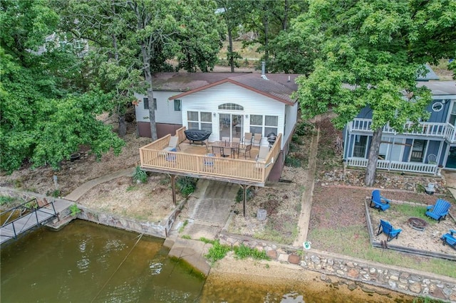 back of house with a deck