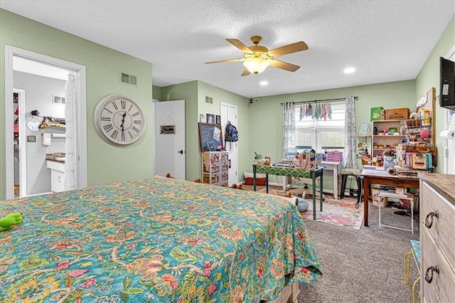 bedroom with a textured ceiling, visible vents, carpet flooring, and recessed lighting