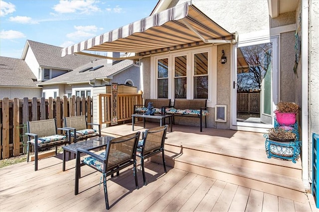 wooden terrace featuring an outdoor living space