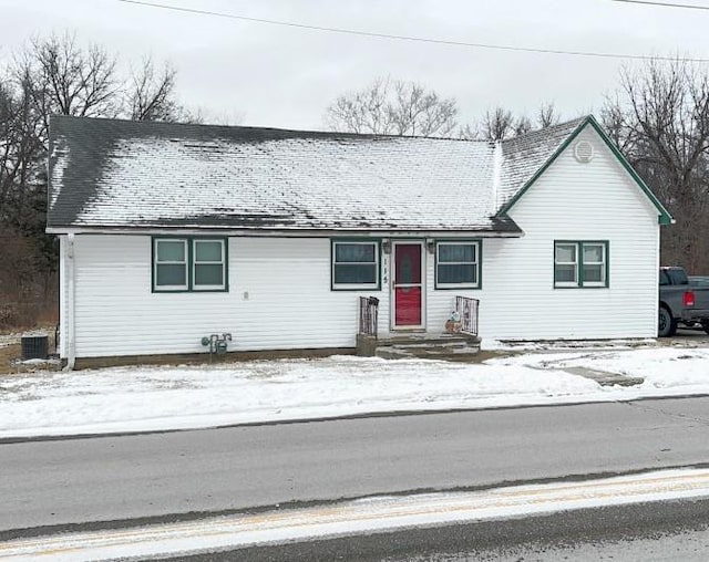 ranch-style house with a shingled roof