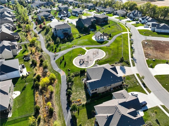 birds eye view of property with a residential view