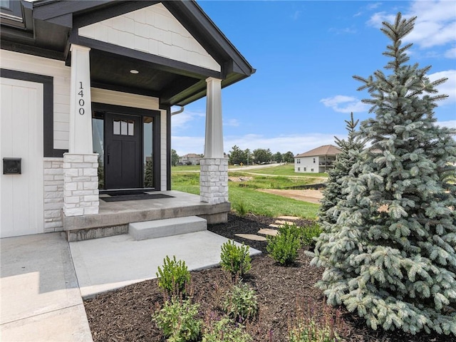 property entrance featuring stone siding