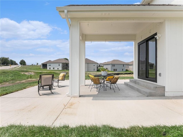 view of patio featuring entry steps and outdoor dining area