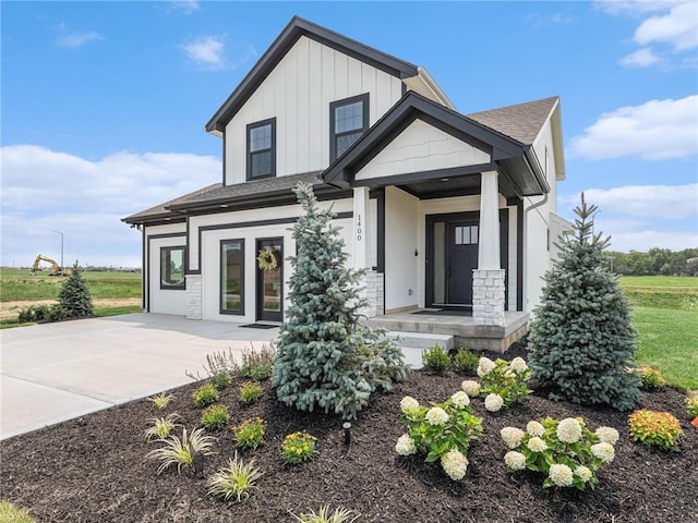 15619 Sheridan Ct, Basehor, KS 66007 - view of front facade with concrete driveway and board and batten siding