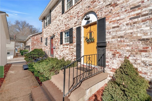 entrance to property with brick siding