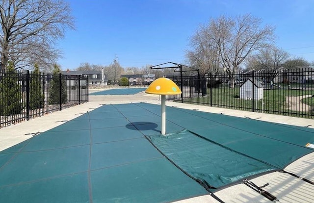 community pool featuring fence