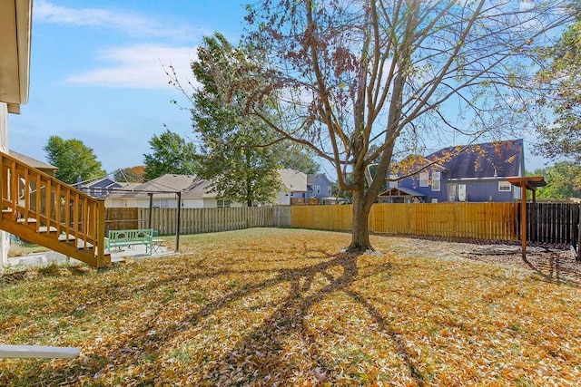 view of yard featuring a patio area and a fenced backyard