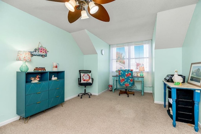 interior space featuring a ceiling fan, carpet, vaulted ceiling, and baseboards