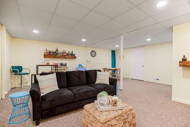 living room with a paneled ceiling, visible vents, carpet flooring, and recessed lighting