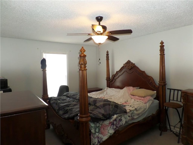 bedroom featuring a textured ceiling and a ceiling fan