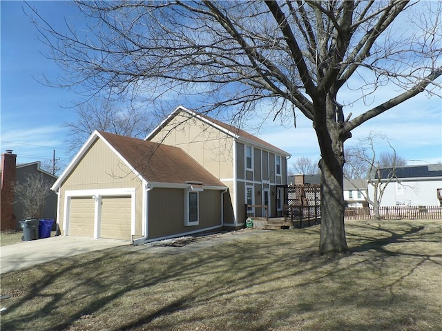 view of side of home with a yard, fence, and roof with shingles