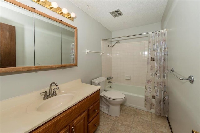 bathroom featuring vanity, visible vents, shower / tub combo, a textured ceiling, and toilet