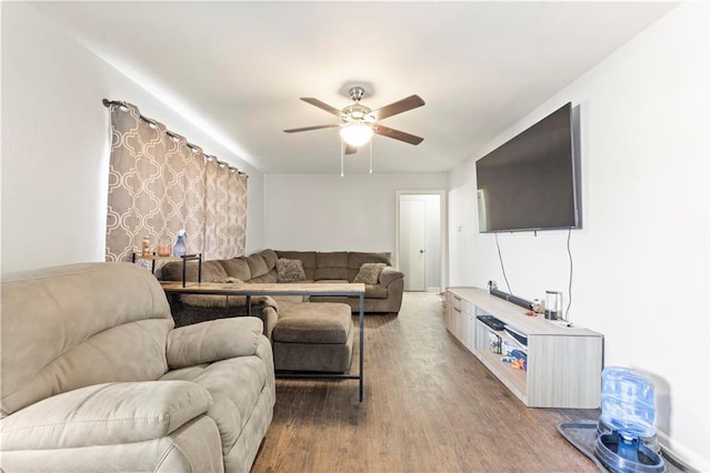 living area with ceiling fan and wood finished floors