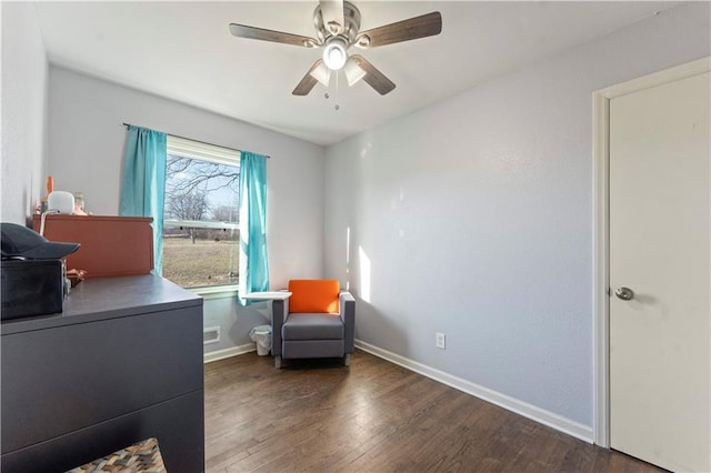 sitting room featuring ceiling fan, baseboards, and wood finished floors