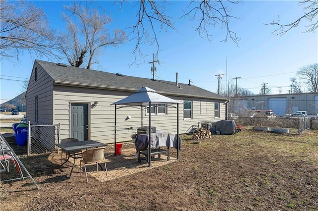 back of house with fence