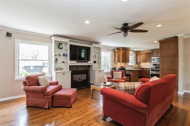 7345 Booth St, Prairie Village, KS 66208 - living area featuring a ceiling fan, wood finished floors, recessed lighting, and crown molding