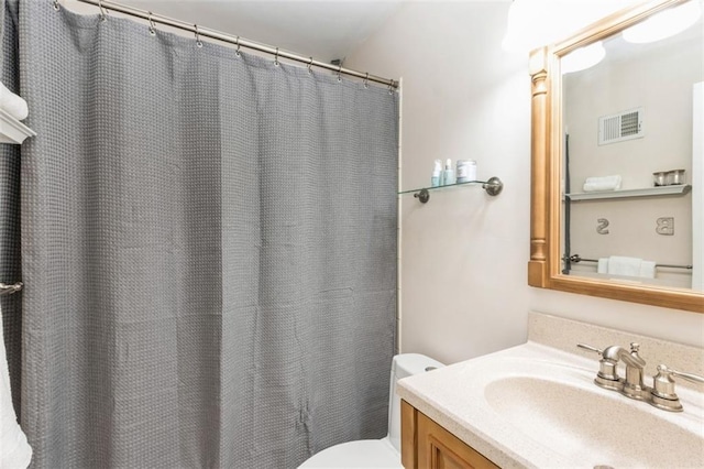 7345 Booth St, Prairie Village, KS 66208 - bathroom with toilet, vanity, a shower with shower curtain, and visible vents