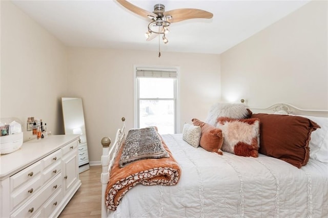 7345 Booth St, Prairie Village, KS 66208 - bedroom featuring ceiling fan, baseboards, and light wood-style flooring