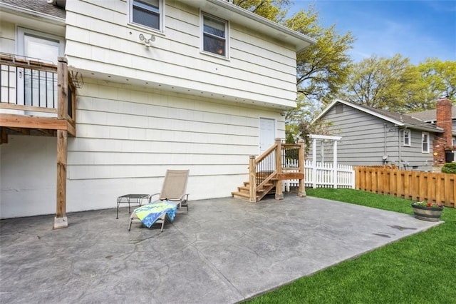7345 Booth St, Prairie Village, KS 66208 - back of property featuring a patio and fence
