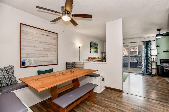 dining room with breakfast area, ceiling fan, baseboards, and wood finished floors