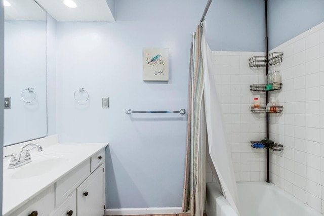 full bathroom featuring shower / tub combo and vanity