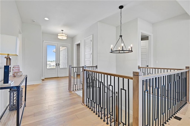 15026 W 129th Ter, Olathe, KS 66062 - hall featuring an upstairs landing, a chandelier, light wood-style floors, and recessed lighting