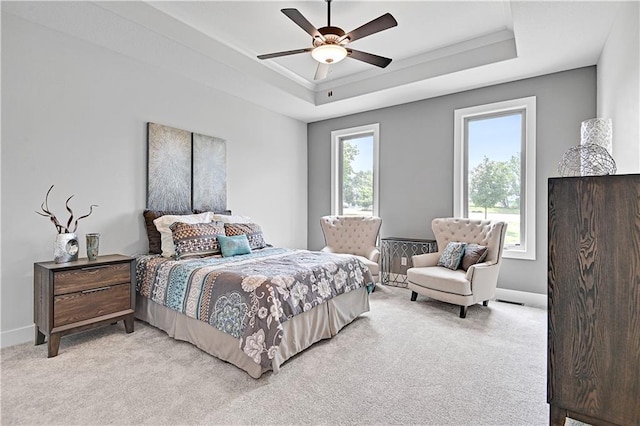 15026 W 129th Ter, Olathe, KS 66062 - bedroom with a raised ceiling, light carpet, and ceiling fan