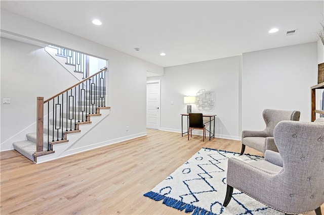15026 W 129th Ter, Olathe, KS 66062 - living room with wood finished floors, stairway, and recessed lighting