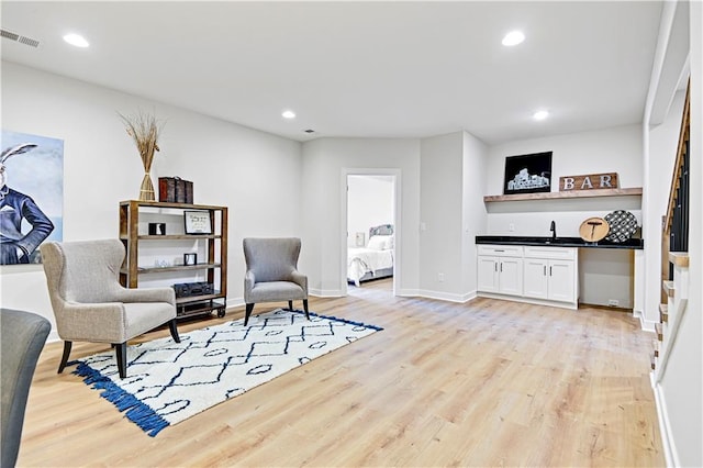 15026 W 129th Ter, Olathe, KS 66062 - sitting room with light wood-style flooring, bar area, and recessed lighting